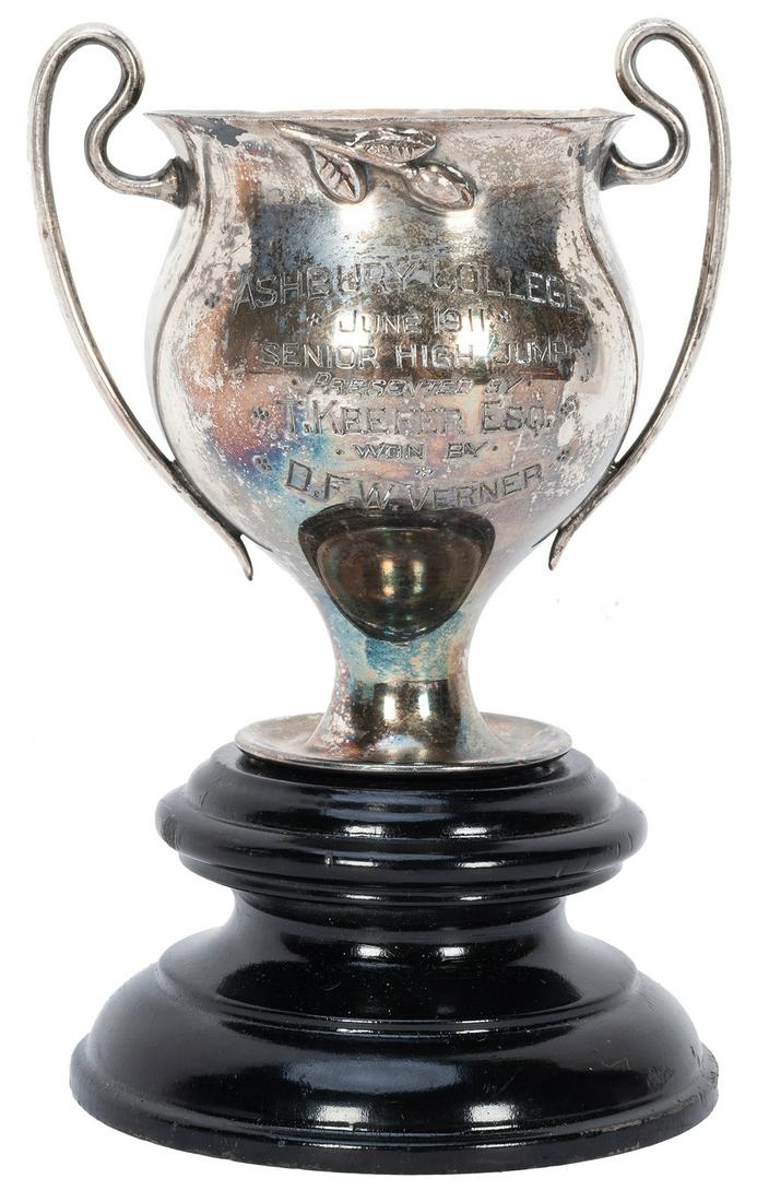 Vernon, Dai (David Frederick Wingfield Verner). Dai: Vernon, Dai (David Frederick Wingfield Verner). Dai Vernon Senior High Jump Trophy. Engraved silver cup on turned wooden base, presented to Vernon for winning a high jump competition at Ashbury Colleg