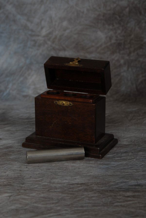 Divination Supreme: Divination Supreme. Los Angeles, F.G. Thayer, ca. 1920. A wooden case 4 x 1 ¾ x 4 " made to hold a solid metal rod in one of three compartments is shown. A spectator places the bar into one of the co