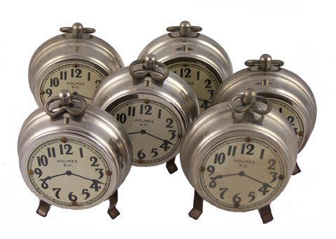 Nest of Clocks: Nest of Clocks. Kansas City, Donald Holmes, ca. 1920. Six nesting faux alarm clocks which can be produced from a borrowed hat, handkerchief, etc. Clock faces measure 2 ¾" in diameter. Good condition.