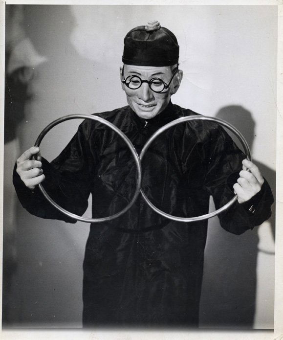 Six photographs of Vernon as "Dr. Chung.": Vernon, Dai. Six photographs of Vernon as "Dr. Chung." 8 x 10" format. Vernon wears a lifelike Asian mask crafted by his wife, Jeanne, and poses with Linking Rings, Rice Bowls, etc. Good condition.