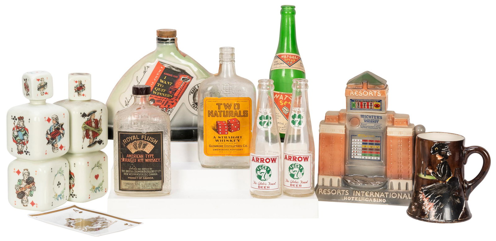 Group of Gambling and Playing Card Glassware and: Group of Gambling and Playing Card Glassware and Ceramics. Including a Beleek mug with painted woman playing cards and chips on the table; milk glass tray with nude design Ace of Spades; Two Naturals 