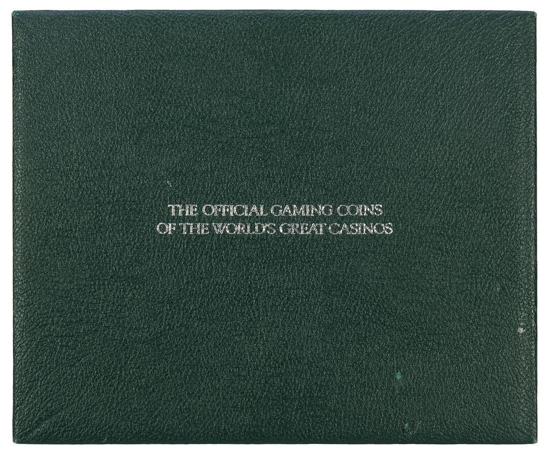 Franklin Mint Gaming Coins of the World's Great: Franklin Mint Gaming Coins of the World's Great Casinos. Set of 25 sterling silver gaming coins casinos around the world, housed in the original green buckram display case. Case worn at edges with scu