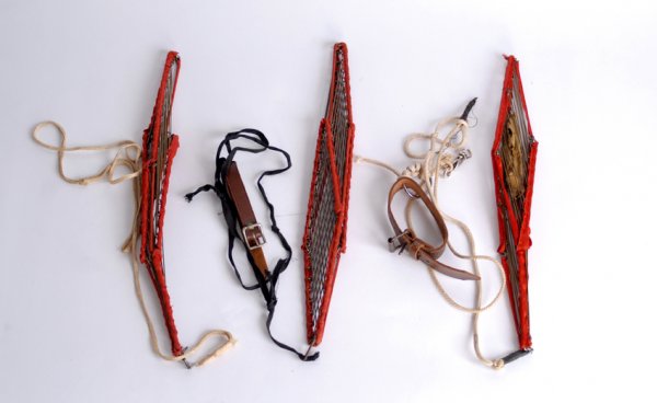 Three vintage Vanishing Birdcages by Abbott's Magi: Vanishing Birdcages (3). Colon, Abbott's Magic Co., ca. 1960. Three examples of the model of vanishing birdcage favored by Harry Blackstone Sr. and Jr. Brass bars trimmed with red ribbon. All with pul