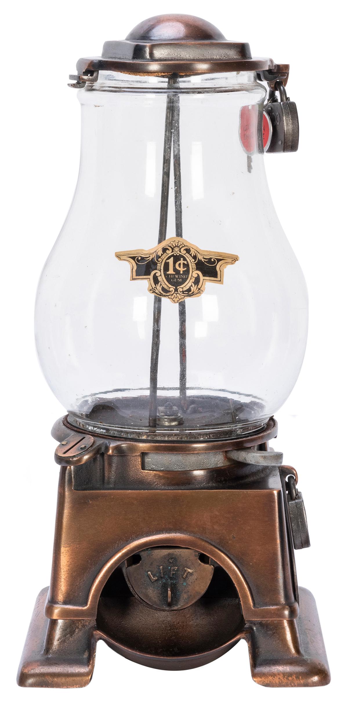 Lehman & Son Vending Co. 1 Cent Peanut Machine. Boston,: Lehman & Son Vending Co. 1 Cent Peanut Machine. Boston, MA, ca. 1910s. Copper body. Height 16 ½”. Restored decal. Lock and key. Working.