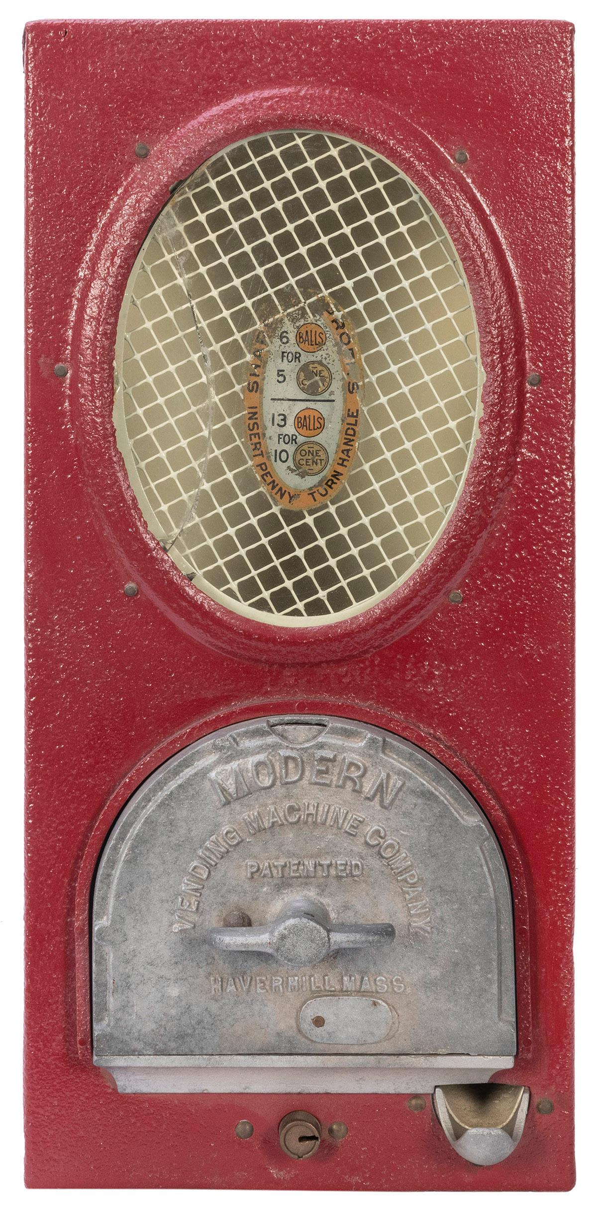 Moderne Vending Machine Co. 1 Cent Vending Machine.: Moderne Vending Machine Co. 1 Cent Vending Machine. Circa 1920s. Add the required number of pennies into the machine and collect your gumballs. Height 16 ½Â”. Crack in glass. Lock and key. W
