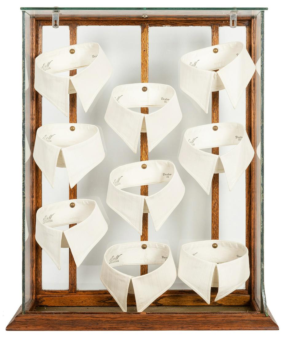 Country Store Oak and Glass Collar Display Case.: Country Store Oak and Glass Collar Display Case. American, ca. 1910s/20s. Displaying nine Earl & Wilson collars, held with pins to the rear posts. Thick glass sides, oak base with felted inner surface