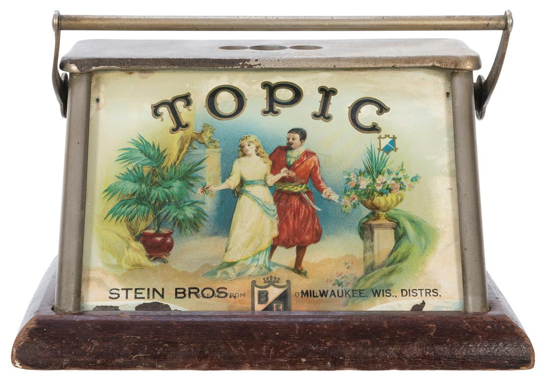 Stein Bros. Countertop Topic Cigar Cutter. Milwaukee,: Stein Bros. Countertop Topic Cigar Cutter. Milwaukee, WI, ca. 1900s. Metal and glass on wood base. 5 3/8 x 8 x 5 ¾ “. Working.