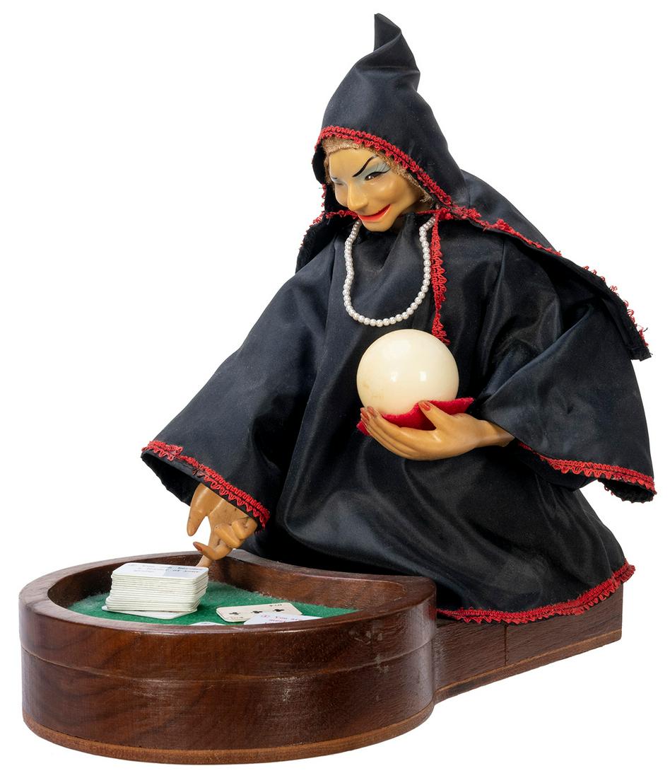 Gypsy Fortune Teller Battery-Operated Toy. Japan:: Gypsy Fortune Teller Battery-Operated Toy. Japan: Ichida, ca. 1950. Witch-like fortune-teller would nod her head, move the crystal ball side to side, light up her eyes, and dispense a fortune card fro