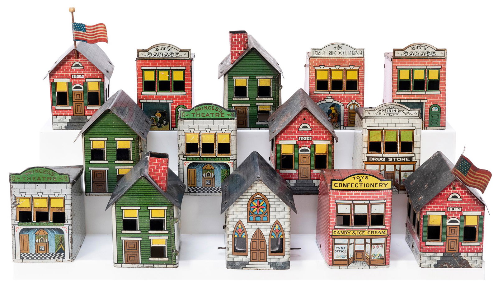 Lot of 20 Tin Litho Candy Container Buildings. Each 3 x: Lot of 20 Tin Litho Candy Container Buildings. Each 3 x 2 x 3”. Several with pitting or slight oxidation, many with bright graphics.