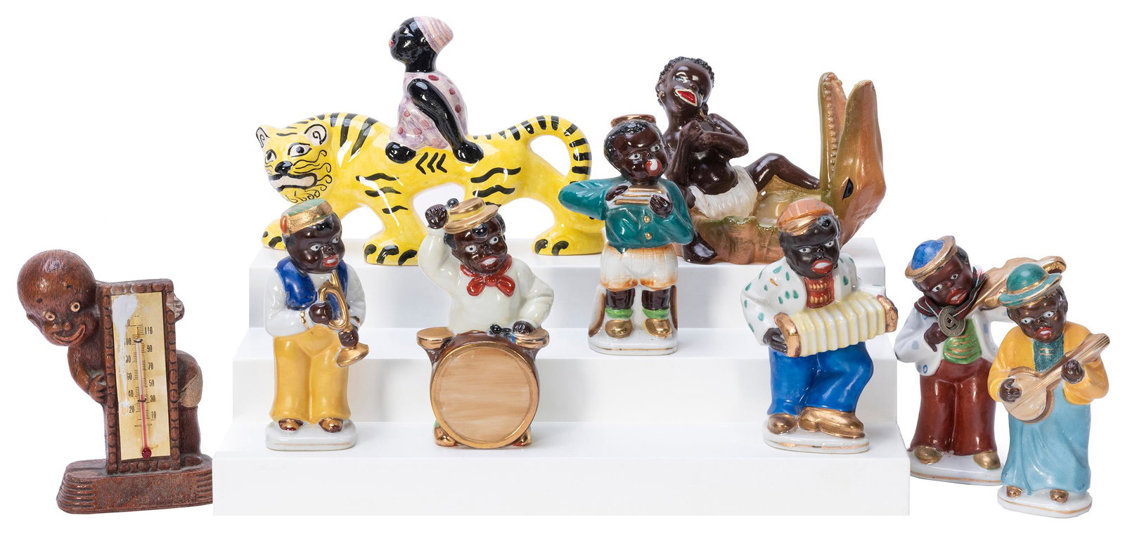 Black Americana Porcelain Jazz Band Figures. Made in: Black Americana Porcelain Jazz Band Figures. Made in Occupied Japan. 6 total. Hand painted musicians. Each 5” tall. –– [Also with:] 3 Black Americana ceramic figurines including an a