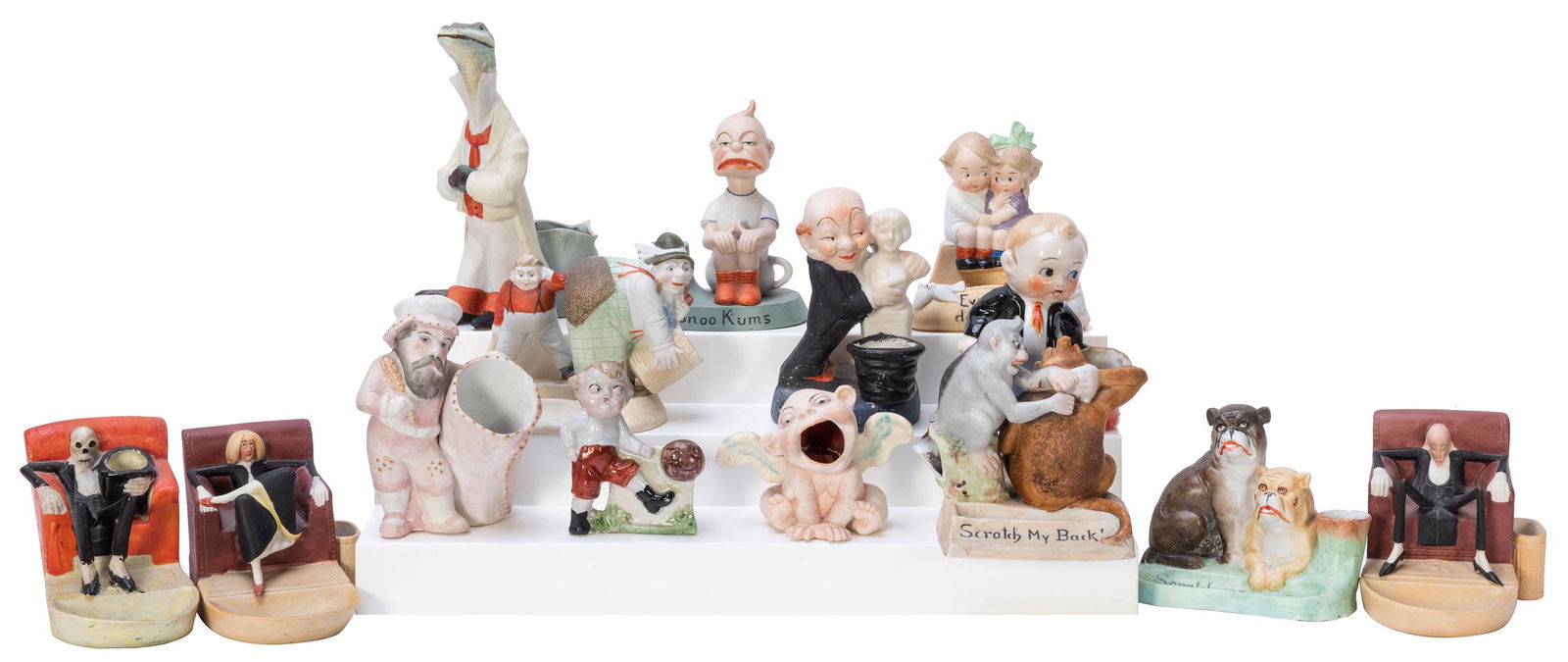 Group of 14 Figural Matchstick Holders. Japan and: Group of 14 Figural Matchstick Holders. Japan and Germany. Painted bisque. Painted porcelain. Several made in the style of Shafer & Vater, others stamped with the Shafer & Vater maker’s mark. Ta