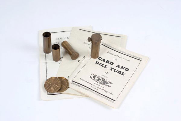 Group of three Brema-made tricks owned by Dai Verno: [Brema] Group of three Brema-made tricks owned by Dai Vernon. Including a Utility Coin Box, Bill Tube and Utility Tube (for exchanging billets, etc.). Each trick hallmarked, with original instructions