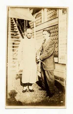Full-length portrait of Houdini with Ching Ling Foo: Houdini, Harry. Full-length portrait of Houdini with Ching Ling Foo. [New York], 1922. The two magicians stand outside a theatre at Brighton Beach, where Foo was appearing. 3 ½ x 5 ". Some wear to ve