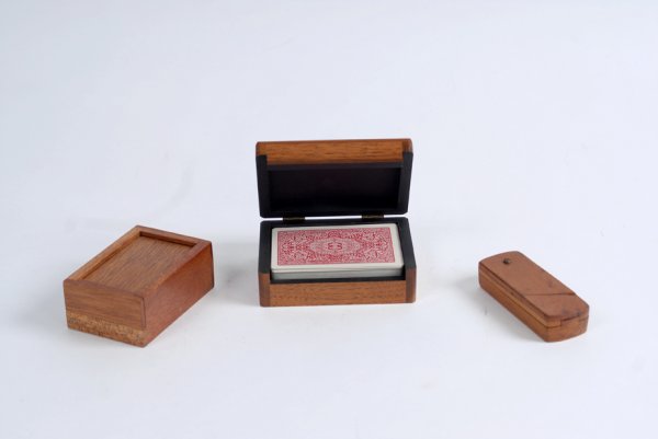Three wooden pocket tricks from the collection of D: [Pocket Tricks] Three wooden pocket tricks from the collection of Dai Vernon. Included are a Haenchen Rattle Box, Joe Berg's Mento Card Box (Haenchen, with original instructions and cards), and a Hoff