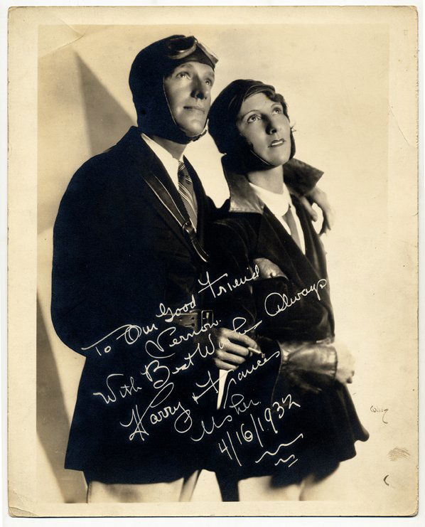 Photograph of Harry and Frances Usher, signed and: Ushers, The. Photograph of Harry and Frances Usher, signed and inscribed to Dai Vernon. Wilson, [New York], 1931. Handsome ¾ length photograph of mindreaders Harry and Frances Usher, dressed as aviat