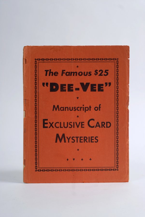 The Famous $25 "Dee-Vee" Manuscript of Exclusive C: [Vernon, Dai and Faucett Ross] The Famous $25 "Dee-Vee" Manuscript of Exclusive Card Mysteries. N.p., n.d. (ca. 1934). Publisher's orange wraps, illustrated. 4to. Significantly tattered and worn at ex