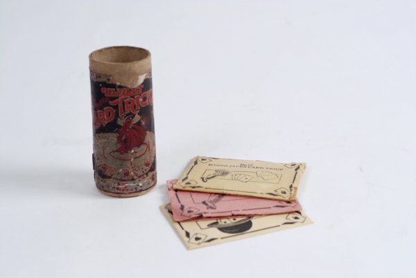 Gilbert Mysto Card Tricks magic set. AC Gilbert Co: Gilbert Mysto Card Tricks magic set. New Haven, A.C. Gilbert Co., ca. 1917. Small mailing tube bearing the lithographed Mysto devil label and accompanied by three DeLand card tricks. Label torn at top