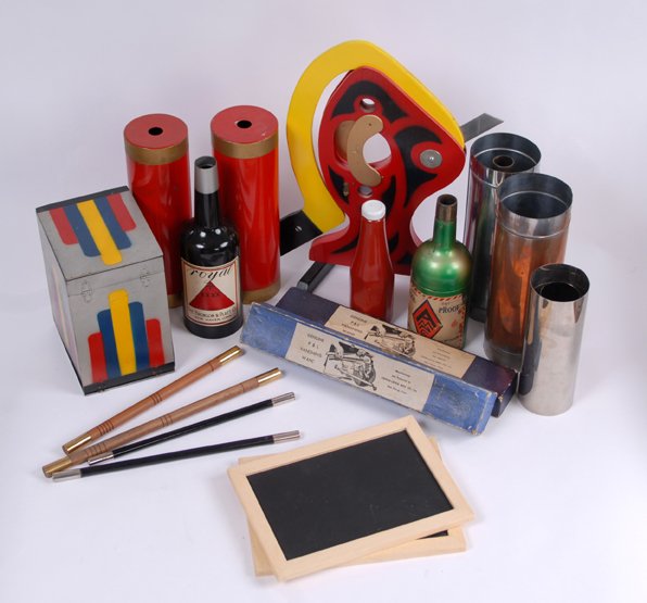 Large accumulation of stage magic props : [Stage Magic] Large accumulation of contemporary stage magic props. Including Spirit Slates (Abbott's), Vanishing Bottle (Nielsen), Mirror Penetration, Drop-Model Production Cabinet (Abbott), Vanishin