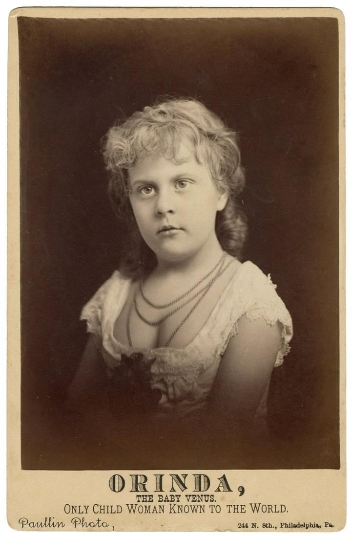Cabinet Photo of “Orinda, the Baby Venus.”: Cabinet Photo of “Orinda, the Baby Venus.” Philadelphia: Paullin, ca. 1884. Bust photograph of “the only child woman known to the World,” the verso with printed background on t