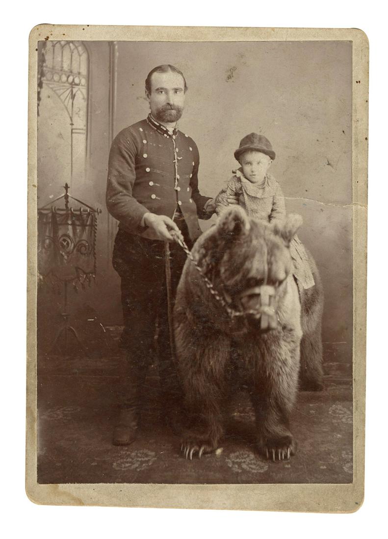 Photograph of a Bear Trainer and his Bear. Circa 1900. (1 of 1)