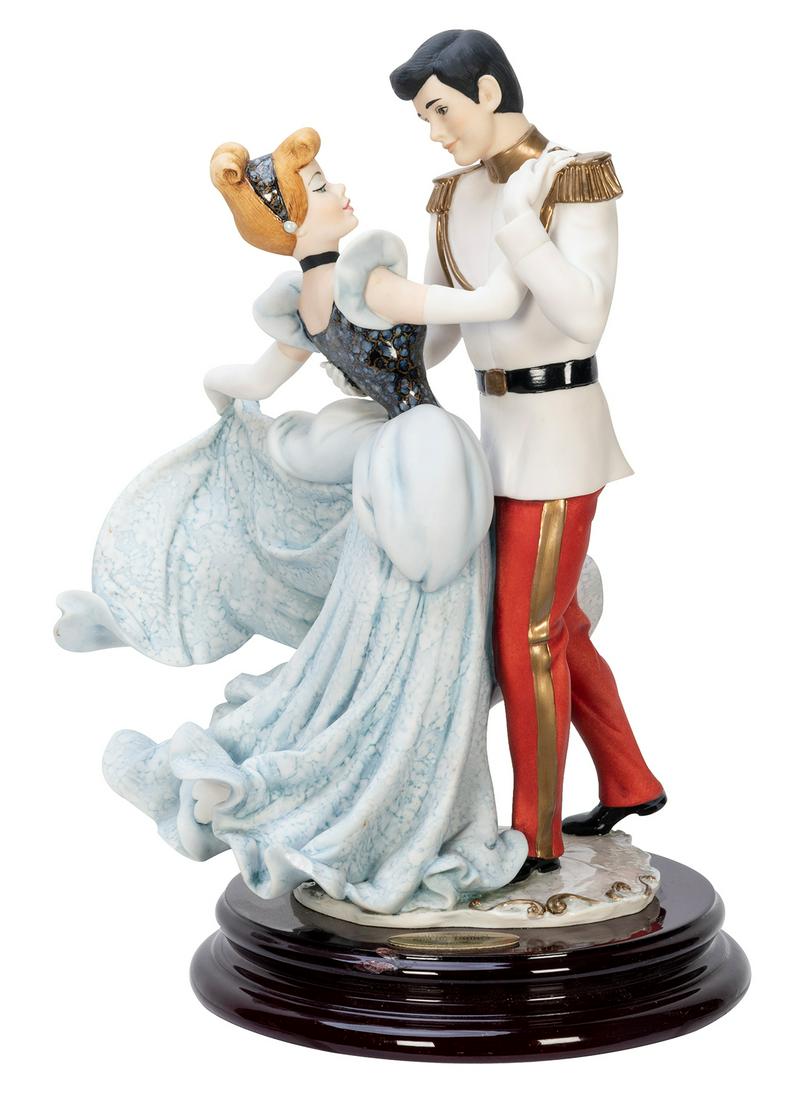 ARMANI, Guiseppe (Italian, 1935-2006). Cinderella and: ARMANI, Guiseppe (Italian, 1935-2006). Cinderella and the Prince. Florence: Sculpture d’Arte. 1998. Porcelain. Height 12”. Chip to base near plaque. Limited edition, 215/1,000.