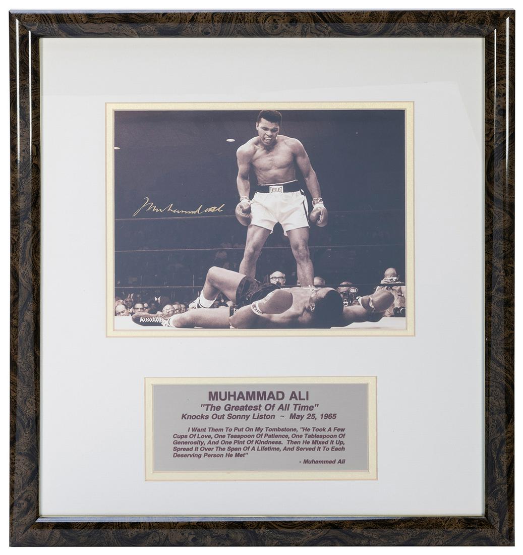 ALI, Muhammad (1942–2016). Signed Photograph.: ALI, Muhammad (1942–2016). Signed Photograph. Sepia toned photo of Ali knocking out Sonny Liston, signed in gold marker. Mounted and framed with plaque. Overall, 18 ½ x 16 ½”. Wi