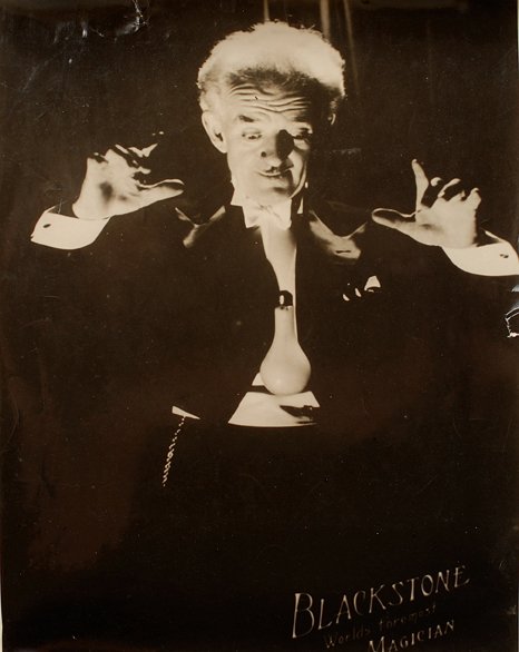 Two oversized performance photos of Blackstone: Blackstone, Harry (Harry Boughton). Two oversized performance photos of Blackstone, Sr. [Bloom Studio], [Chicago], ca. 1946. Large black-and-white photographs of Blackstone performing his trademark tr