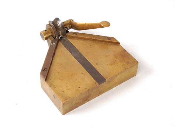 Corner Rounder. Likely made by Geo Graham, ca. 1930: Corner Rounder. Likely made by George Graham, ca. 1930. Handsome all-brass corner rounder measures 4 ¾" x 5 1/8" at its widest points. Wear and patina from age, but good working condition.