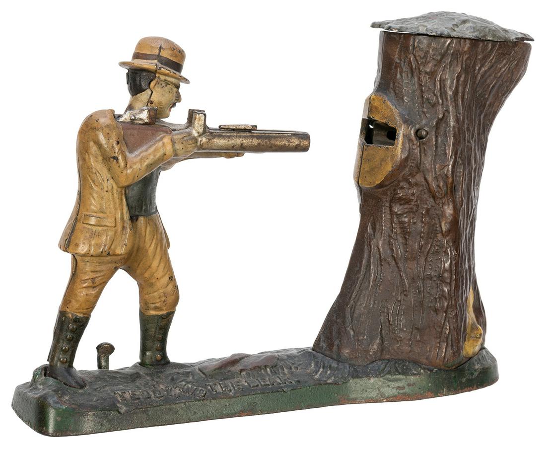 Teddy and the Bear Bank. Cromwell, CT: J.E. Stephens,: Teddy and the Bear Bank. Cromwell, CT: J.E. Stephens, ca. 1900. Cast iron mechanical bank depicts Teddy Roosevelt hunting a bear, who pops out of a tree when the gun is fired, depositing a coin in the