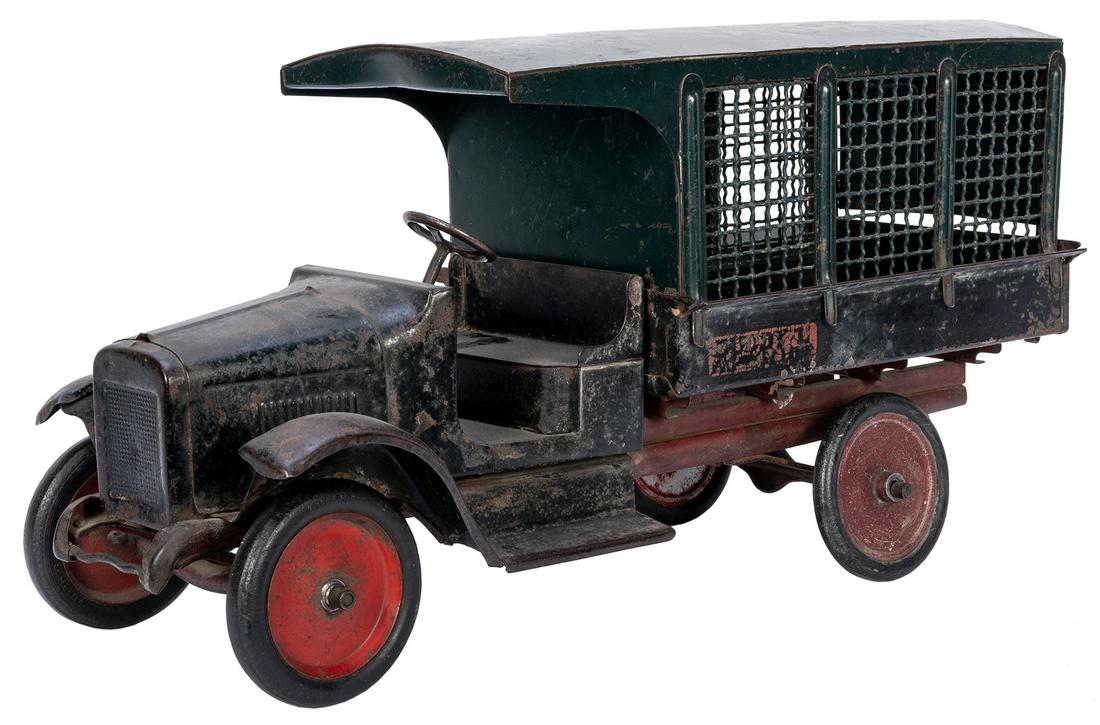 Buddy L Railway Express Truck. East Moline, IL, ca.: Buddy L Railway Express Truck. East Moline, IL, ca. 1920s. Pressed steel. Original back gate and back doors. 24 ½” x 9 x 12”. Paint worn.