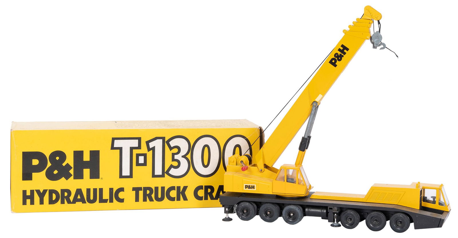 Gescha P&H T-1300 Hydraulic Truck Crane No. 3071. Made: Gescha P&H T-1300 Hydraulic Truck Crane No. 3071. Made in W. Germany. 1:50 scale. Housed as-new in original box in Styrofoam insert. Length (box) 12 ¾”.