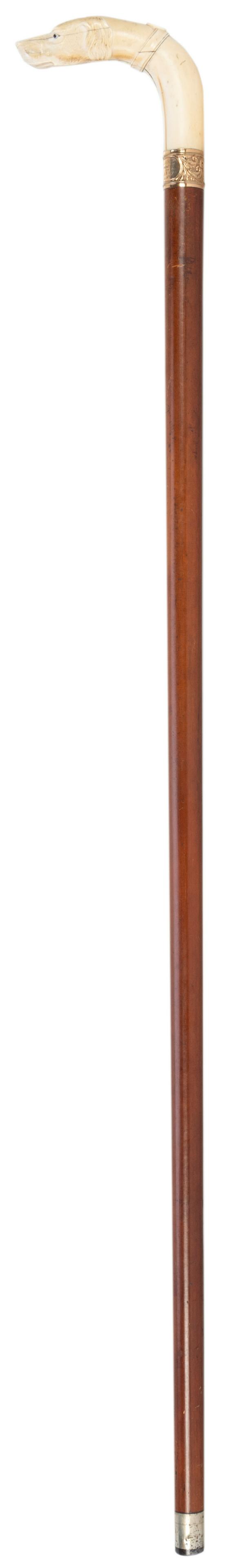 American 19th Century Presentation Cane with Carved: American 19th Century Presentation Cane with Carved Handle. Walnut shaft with finely carved bone handle in shape of dog’s head. Length 36”. Gold decorative band engraved, “Dr. C.C. W