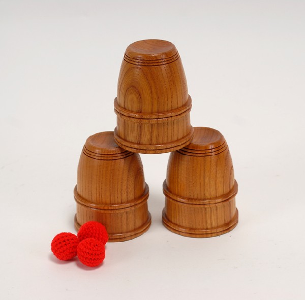 Mikame Craft Cups and Balls. Japan, Mikame Craft: [Cups and Balls] Mikame Craft Cups and Balls. Japan, Mikame Craft, ca. 1980. Set of three wooden turned cups with two matching sets of four red crocheted balls. Cups stand 3 3/8" high with an opening 