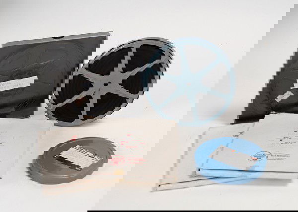 Group of four magic-related 16mm films: [Films] Group of four magic-related 16mm films. Including one labeled "1958 – Vernon Trip to England," two CineMagic films of Fred Kaps (likely commercially marketed), and one large reel of film lab