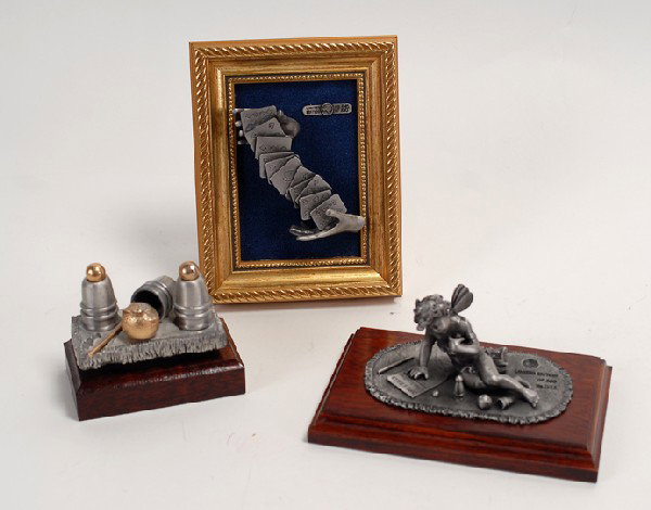 3 Ray Bradbury pewter magic-themed statuettes : [Statuettes] Three pewter magic-themed statuettes sculpted by Ray Bradbury. One, titled "Magical Moments," depicts an angel toying with a set of cups and balls, another shows a pair of hands between w