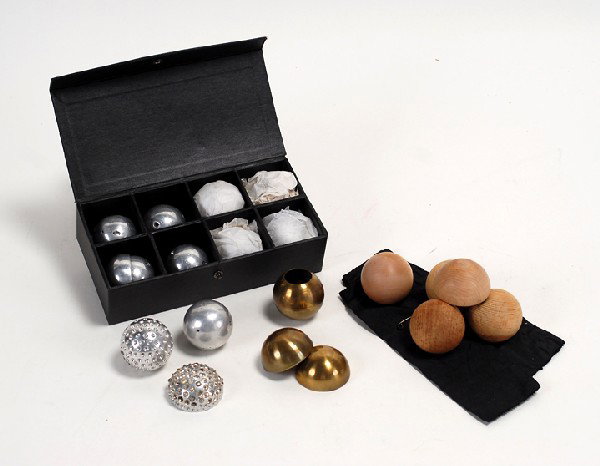 Paul Fox's set of eight aluminum billiard balls: Paul Fox's Billiard Balls. Set of eight aluminum billiard balls for the classic manipulation feat. In a fitted case with eight compartments. Accompanied by two cloth ball holders, three shells (two un