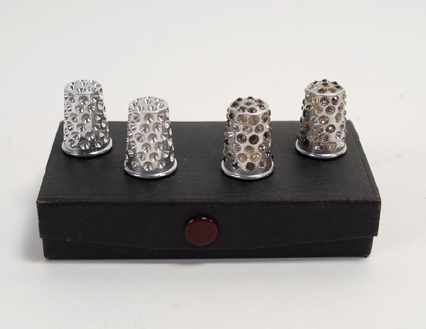Paul Fox's Manipulation Thimbles. Set of seven: Paul Fox's Manipulation Thimbles. Set of seven sturdy metal thimbles for one of Paul Fox's favorite and best-known routines: the multiplication of thimbles in his bare hands. Accompanied by wooden sta
