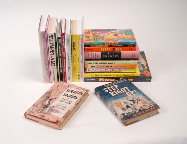 28 books about con games, carnies, hoaxes, etc. : [Cons, Carnies and Hoaxes] Group of 28 books about con games, carnies, hoaxes and related subjects. Including The Billion Dollar Bait by Burling Hull (1977), Carnival Gaffs by Walter Gibson (1976), Gr