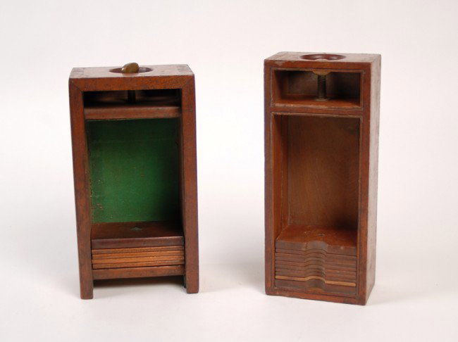 Two vintage open-top playing card presses.: Two open-top card presses. Both being wooden presses that will accommodate multiple decks. One formerly a closed-top press but lacking the sliding door. One press bears the paper label of Jack Chanin'