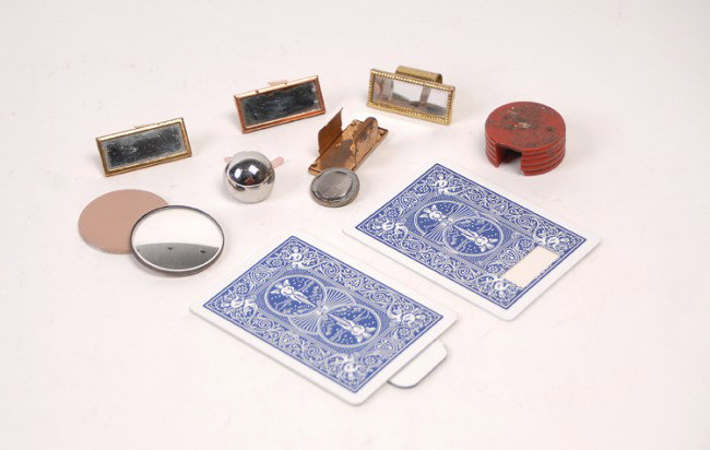 Collection of 10 Shiners: Collection of 10 Shiners. Including two lap shiners, one coin shiner and five fingertip/clip shiners, and two reflective shiners built in to playing cards. 1950s – 2000s. Generally good condition.