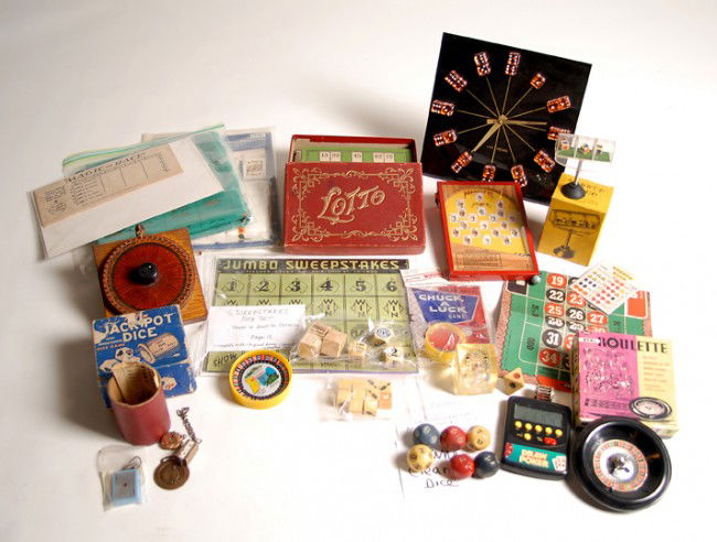 Gambling Novelties, dice and games. 20 items: Gambling Novelties, dice and games. Over 20 items, including vintage Bank Clearing Dice, Chuck-A-Luck pocket game with original packaging, Hunt & Co Sweepstakes Dice set with board, an early "Lotto" b