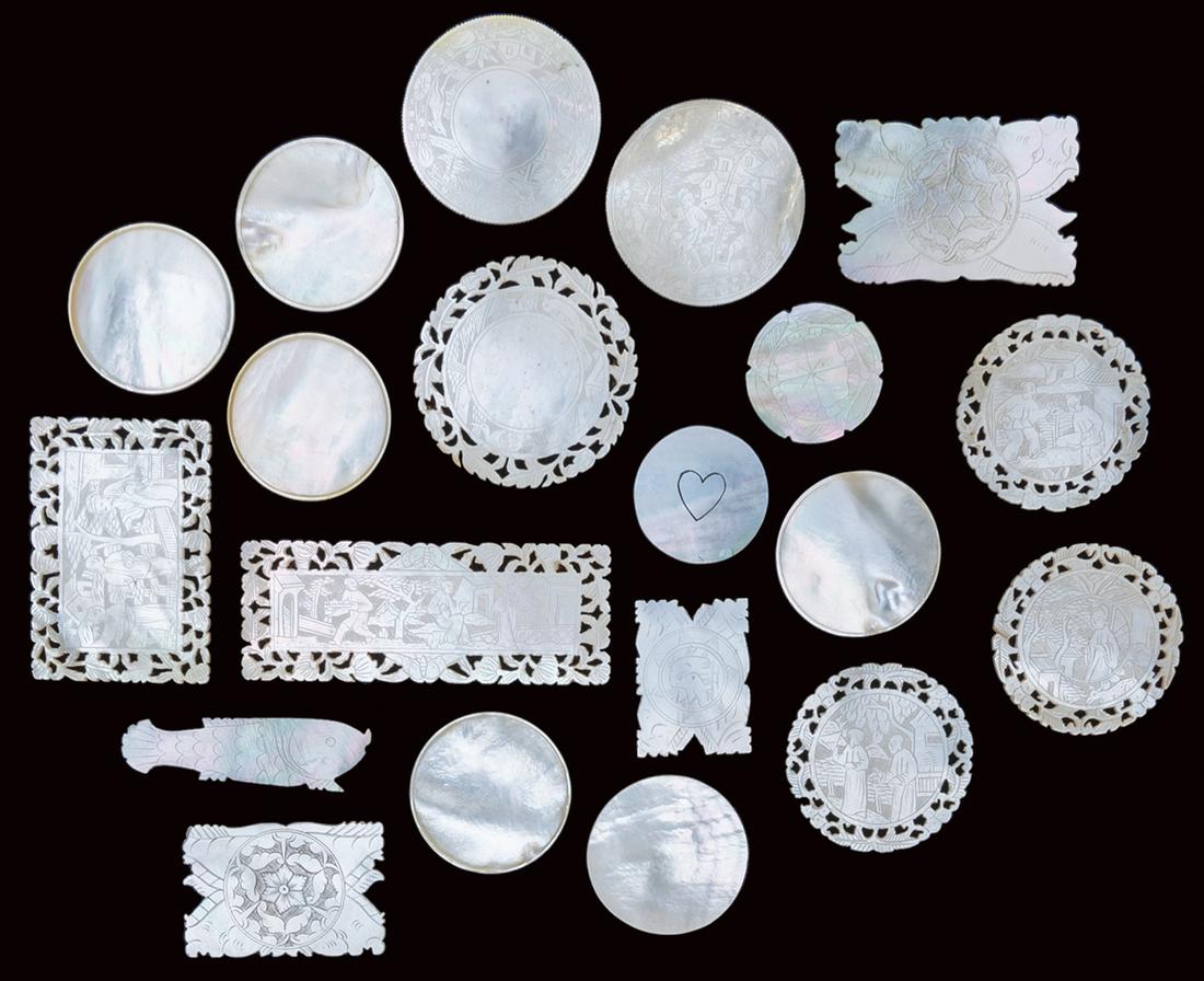 A group of Mother of Pearl gambling chips.: A group of Mother of Pearl gambling chips. Approximately 79 engraved mother of pearl gaming chips in a variety of styles, many with pictorial scenes.