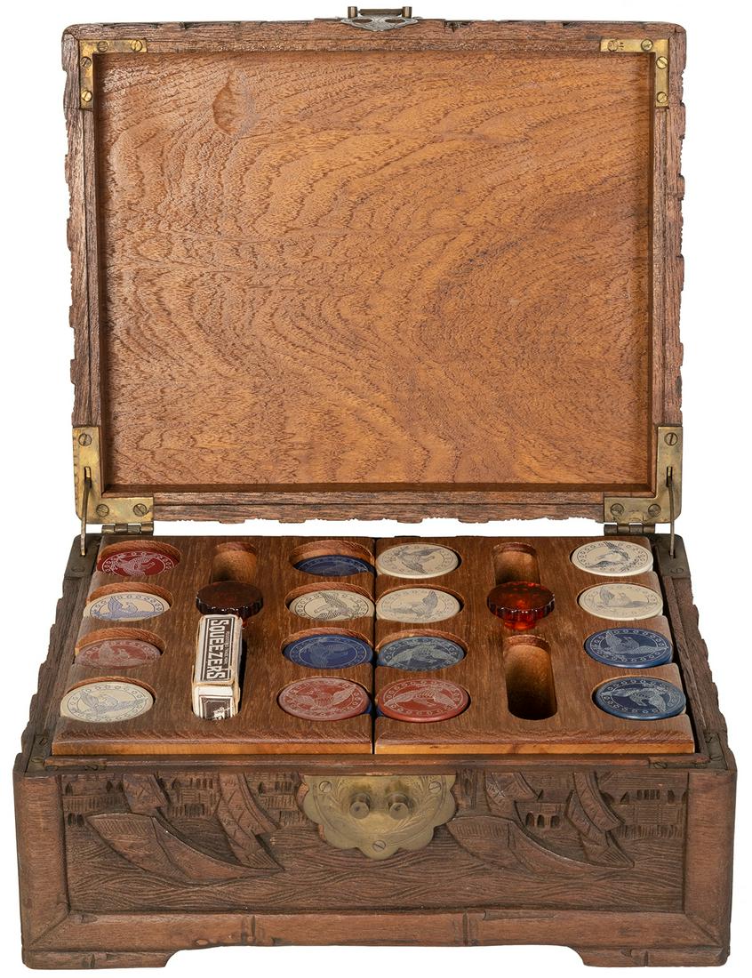 A Carved Cased Set of Eagle Poker Chips with Samuel: A Carved Cased Set of Eagle Poker Chips with Samuel Hart Playing Cards. Circa early 20th century. Intricately carved wooden case depicting sailing vessels or junks. With two caddies inside filled with