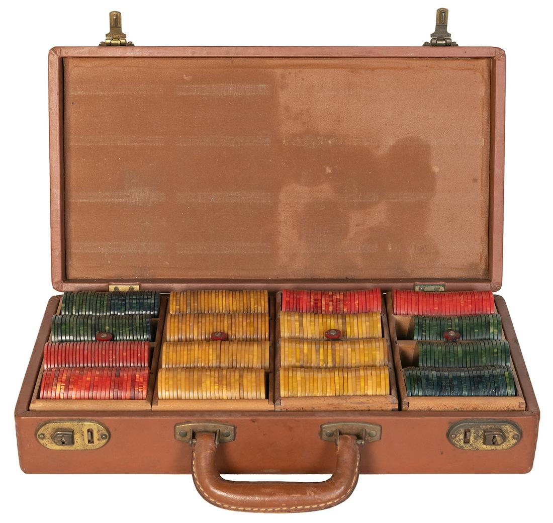 Case of Swirled Bakelite Gaming / Poker Chips.: Case of Swirled Bakelite Gaming / Poker Chips. Approximately 410 chips altogether, in red, butterscotch, and midnight green. Housed in four trays within a leather-covered clasping case stamped The Whi