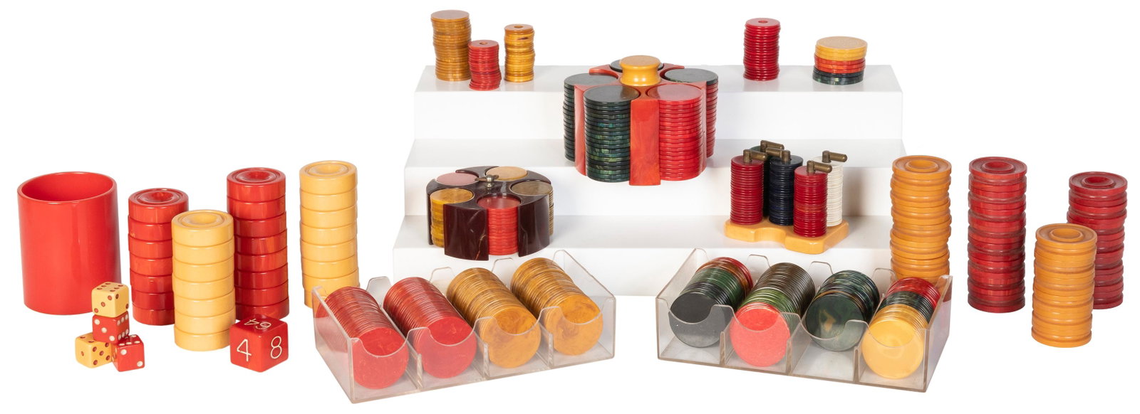 Collection of Catalin Bakelite Chip Caddies, Backgammon: Collection of Catalin Bakelite Chip Caddies, Backgammon Pieces, and Chips. Lot includes (2) Catalin/Bakelite chip caddies with counters (chip diam. 1” and 1 3/8”); (2) sets of 30 backgammo