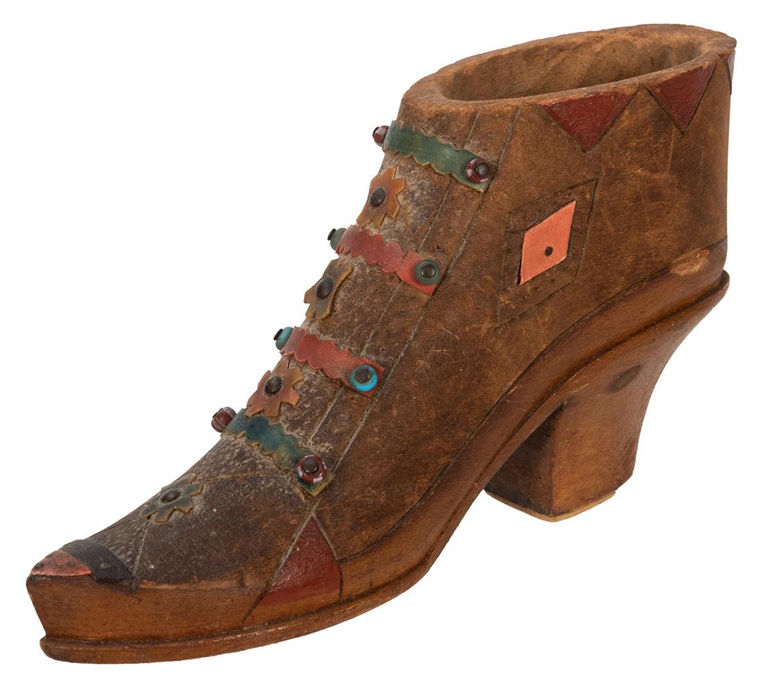 Wooden Folk Art Shoe Dice Shaker. Small shaker in the: Wooden Folk Art Shoe Dice Shaker. Small shaker in the form of a shoe, which, when turned over to view the sole, reveals a window behind which sit a pair of dice which can be shaken. Well made. Length 