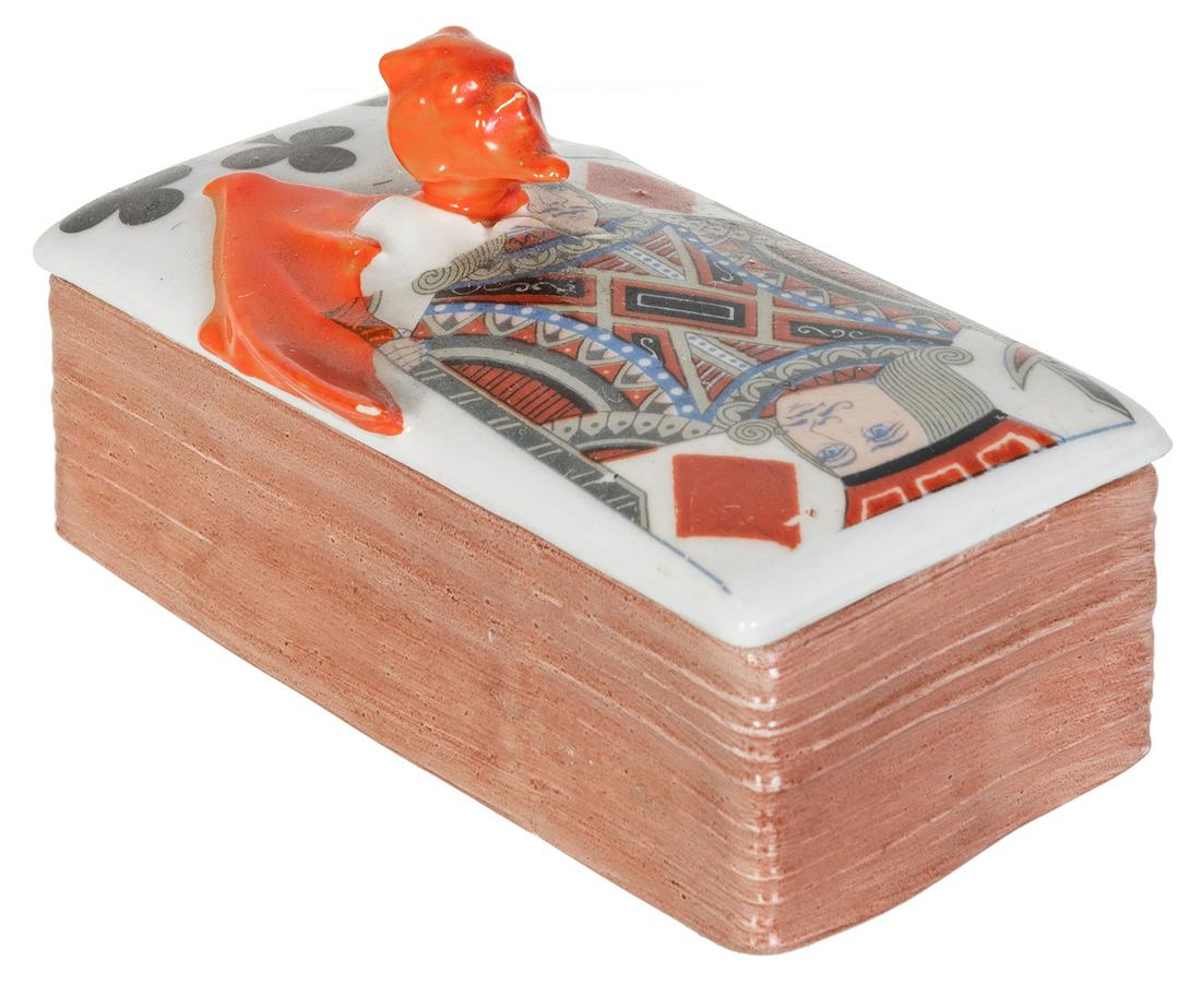 Royal Bayreuth Devil & Cards Stamp Box. Lidded stamp: Royal Bayreuth Devil & Cards Stamp Box. Lidded stamp box depicting the Devil, the Jack of Diamond, and a card in the suit of Clubs. Blue mark. 3 5/8 x 1 ¾ x 2”.