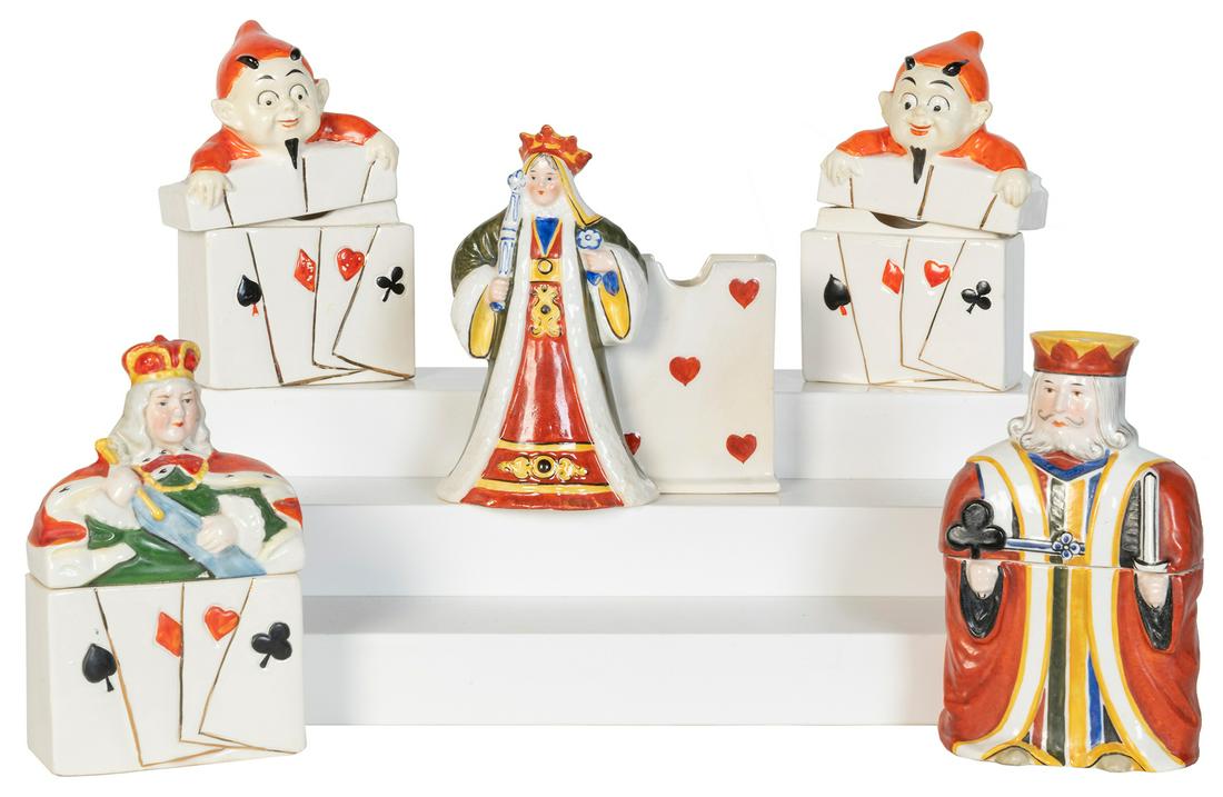 Five Playing Card Porcelain and Ceramic Deck Holders.: Five Playing Card Porcelain and Ceramic Deck Holders. Group of playing card deck holders depicting devil-children, kings, and queens, each with a single deck capacity. Tallest 6”. One (devil-chi