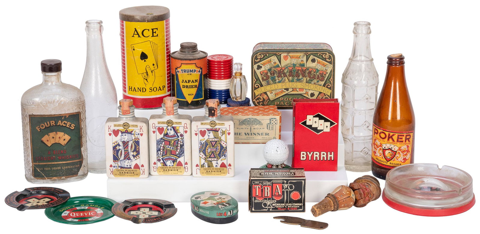 [ADVERTISING – GAMBLING]. Group of vintage: [ADVERTISING – GAMBLING]. Group of vintage gambling-themed advertising items. Over 20 pieces, including bottles, tins, product containers, a Shirley Chisholm “Don’t Gamble in ‘