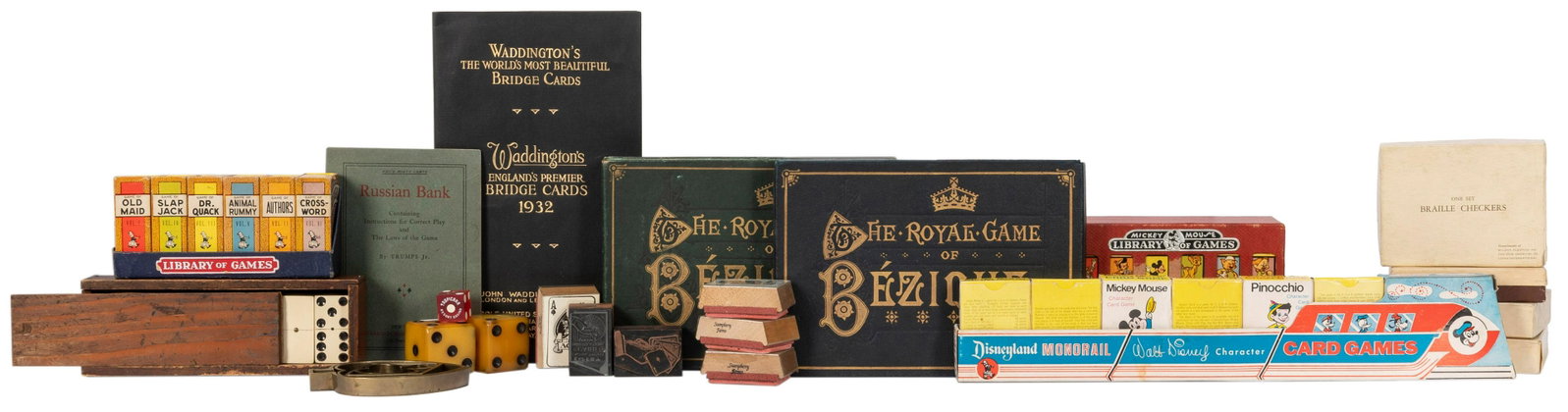 [GAMES]. A group of 13 games and amusements. 20th: [GAMES]. A group of 13 games and amusements. 20th century. A wide variety of games and amusements, including miniature card games featuring Walt Disney characters ca. 1930s/50s, braille checkers, play